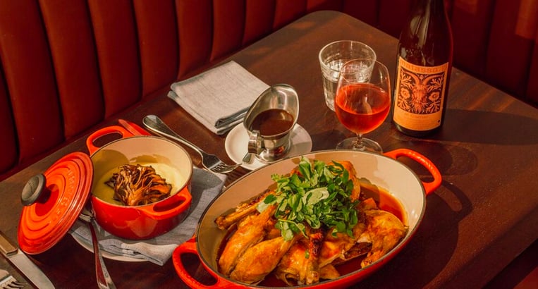 Frenchette NYC table illustration with turkey and wine