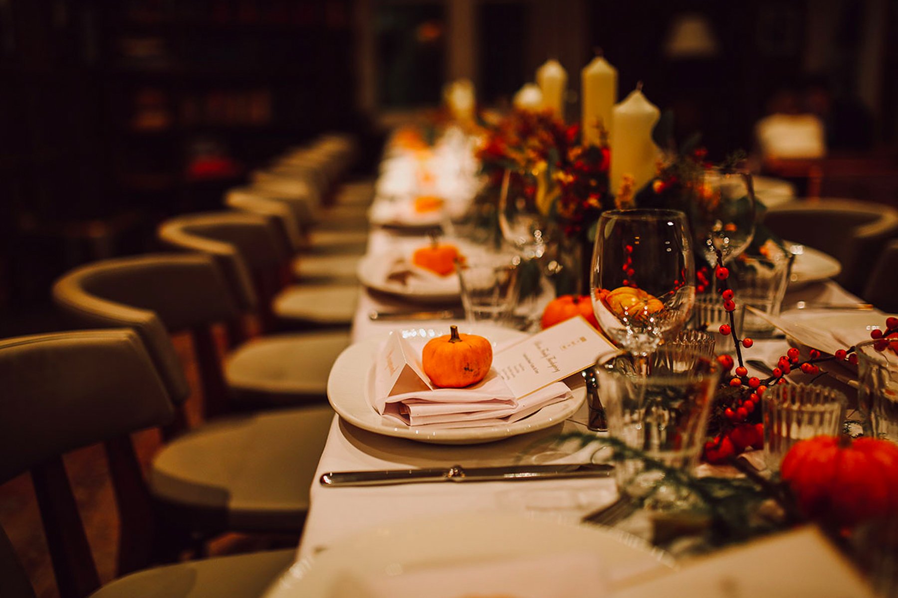 Fall themed restaurant setting with long table and chairs