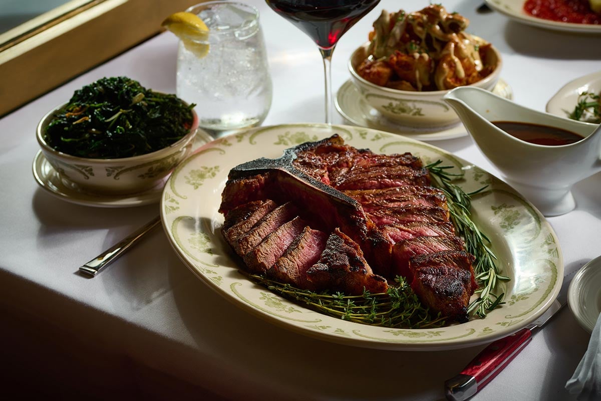 Steak on table with side dishes