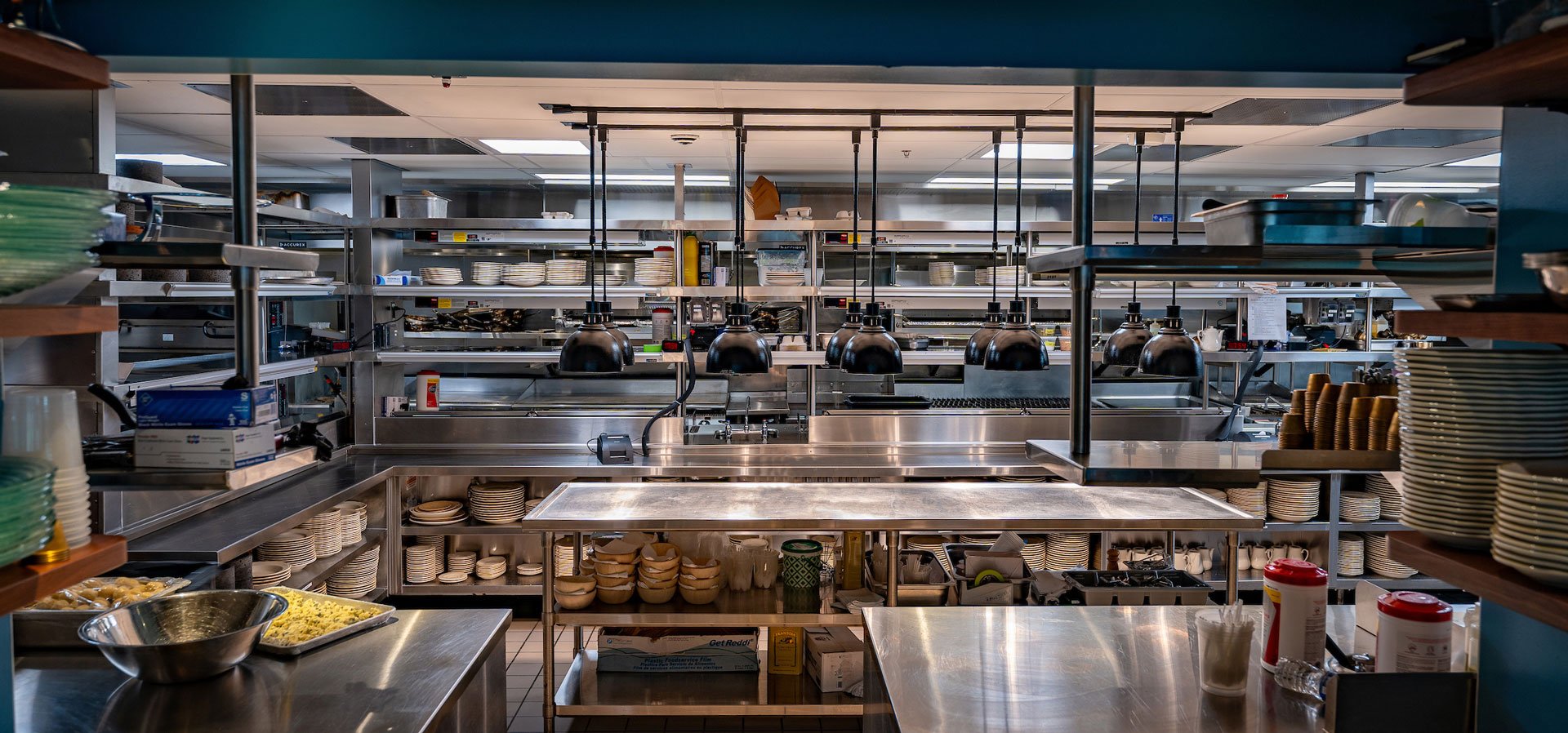 El Presidente kitchen interior with shelves and serving stations for waiting staff