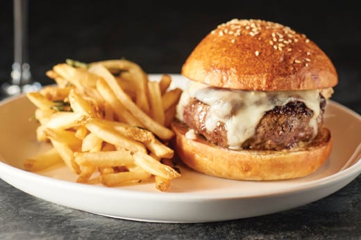 A plate with a burger and fries from Shands General
