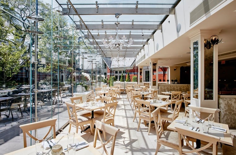 Bright and sunny shot of the Tavern on the Green dining room