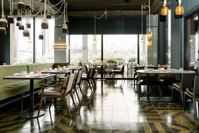 Shot of restaurant tables against the view of NYC