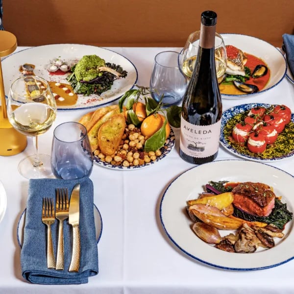 Table spread with wine and silverware at 87 Sussex