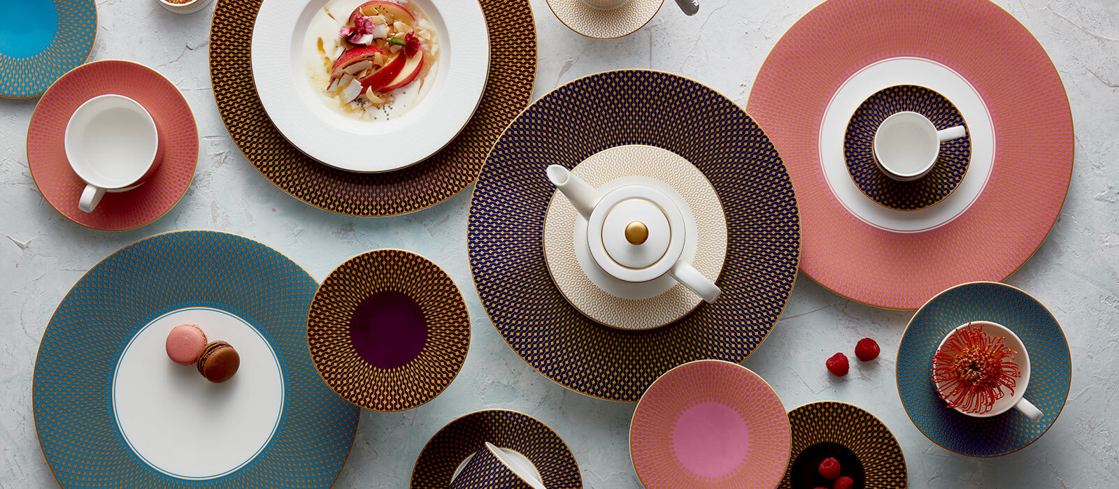 Overhead shot of different plating with teapots and cups on top