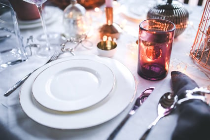 Table setting with plates, dining ware and glassware