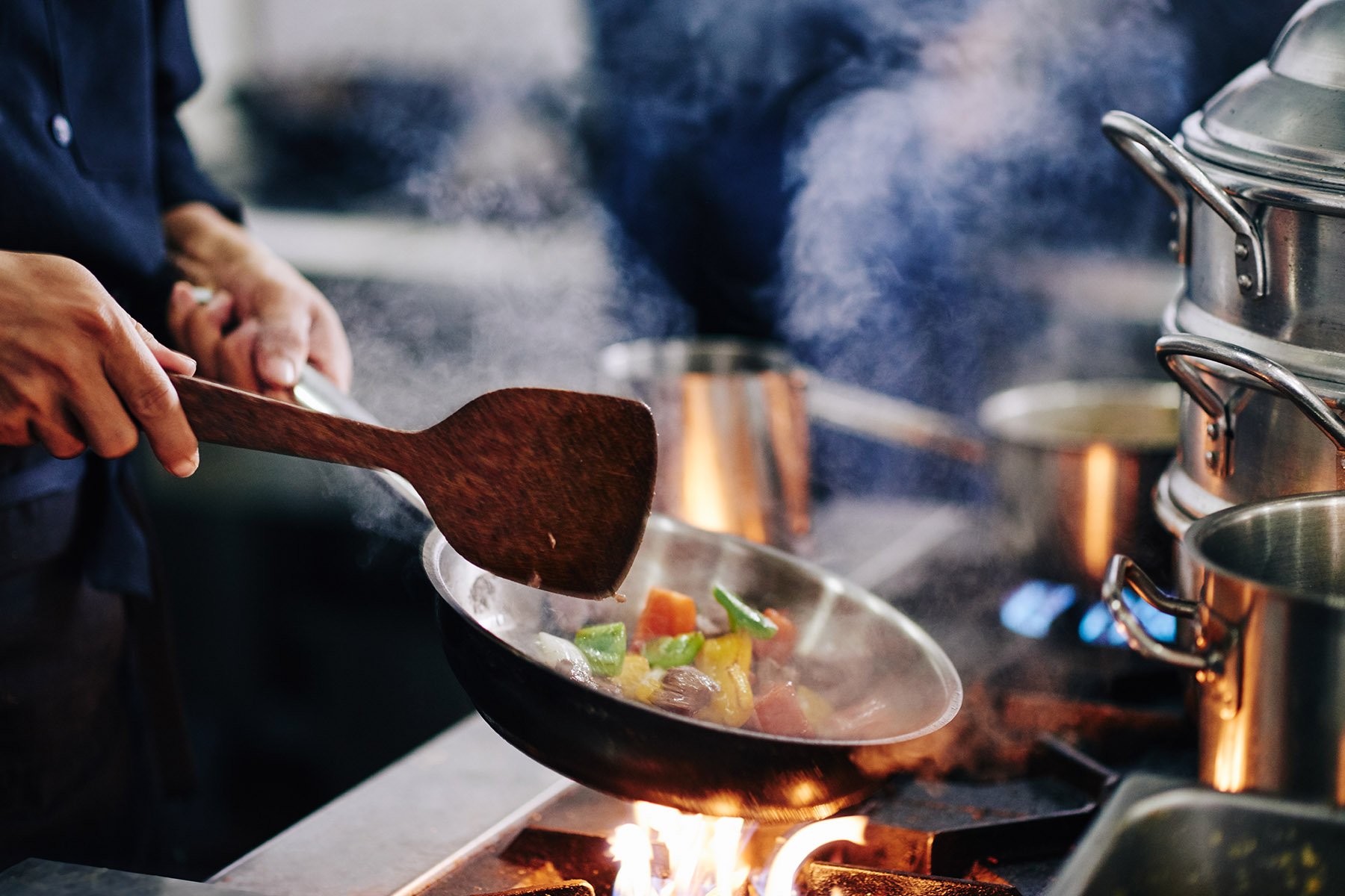 chef cooking a meal on the stove