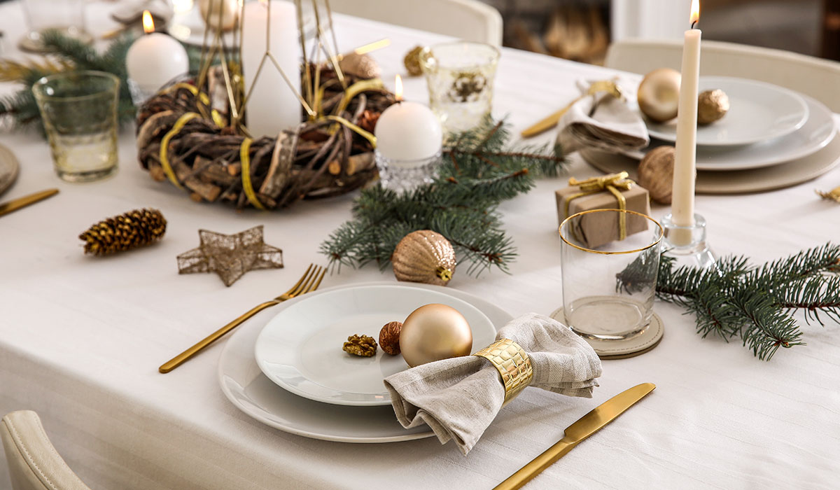 Beautiful table setting with Christmas decorations in living room
