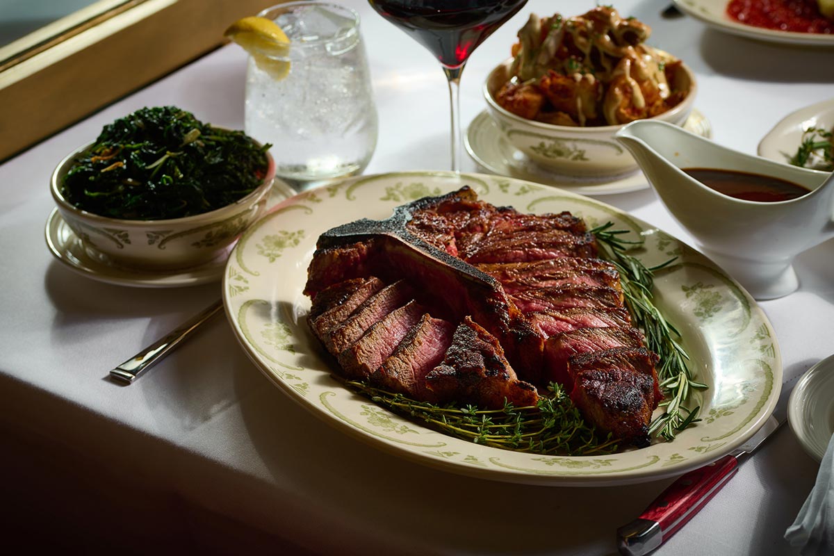 Steak on table with side dishes