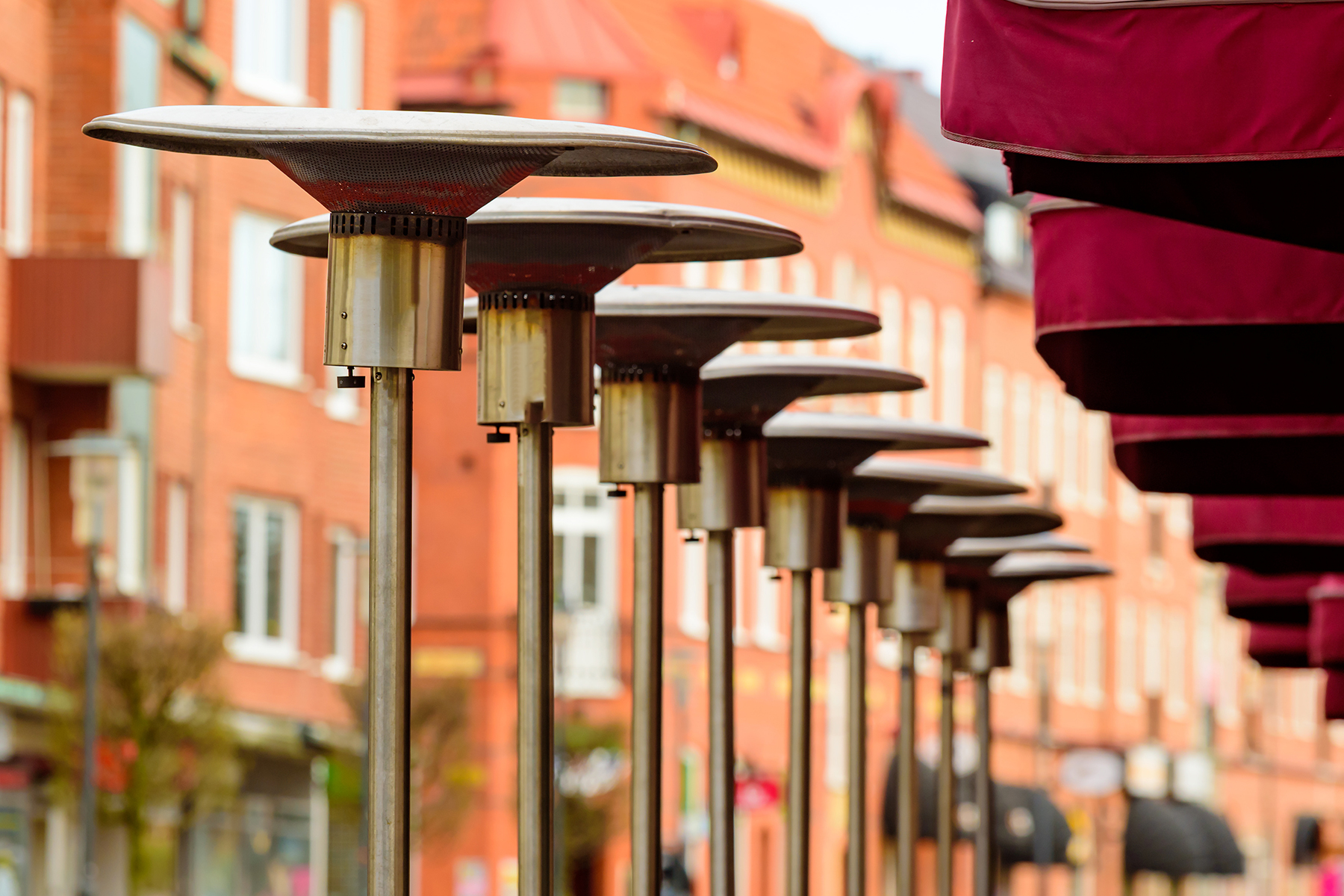 Outdoor heaters lined up outside city restaurant