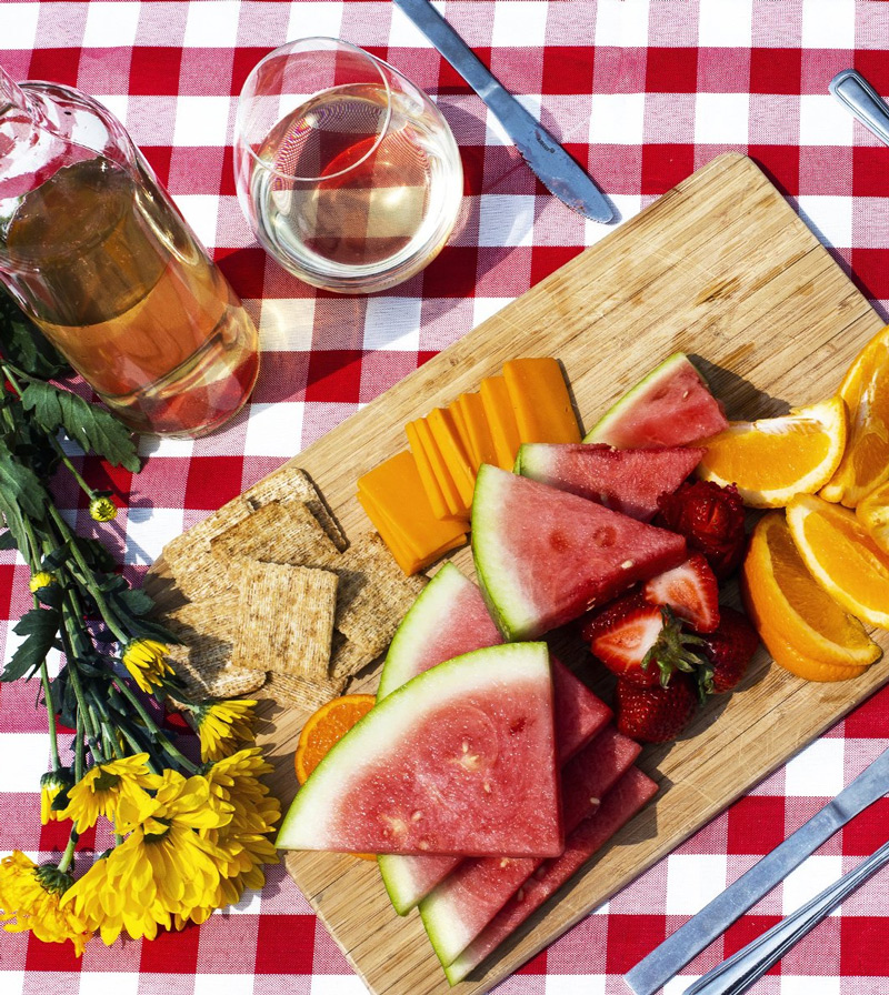 Overhead-view-of-picnic-setting-on-red-and-white-blanket