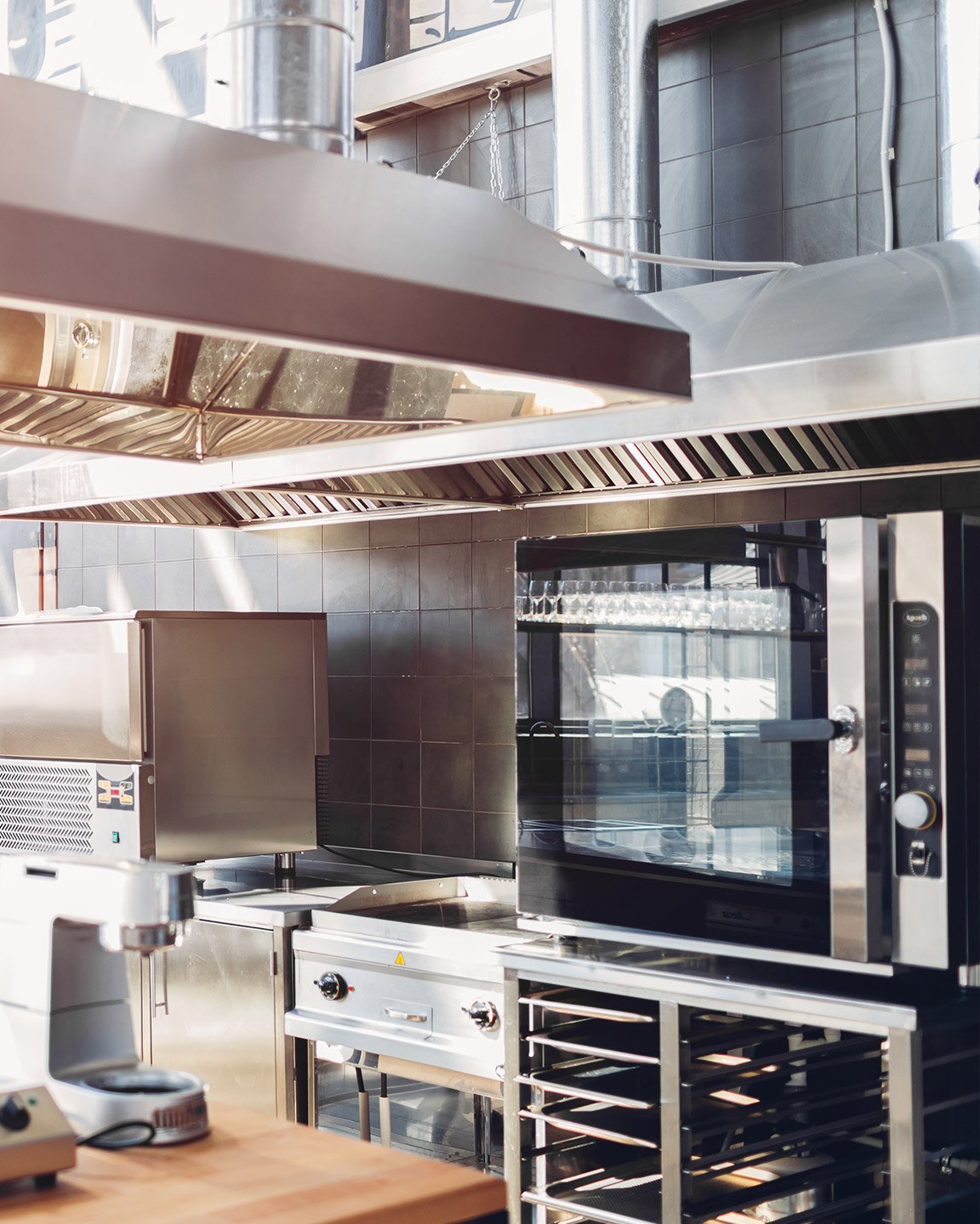 Stainless Steel and Hardwood Themed Restaurant Kitchen
