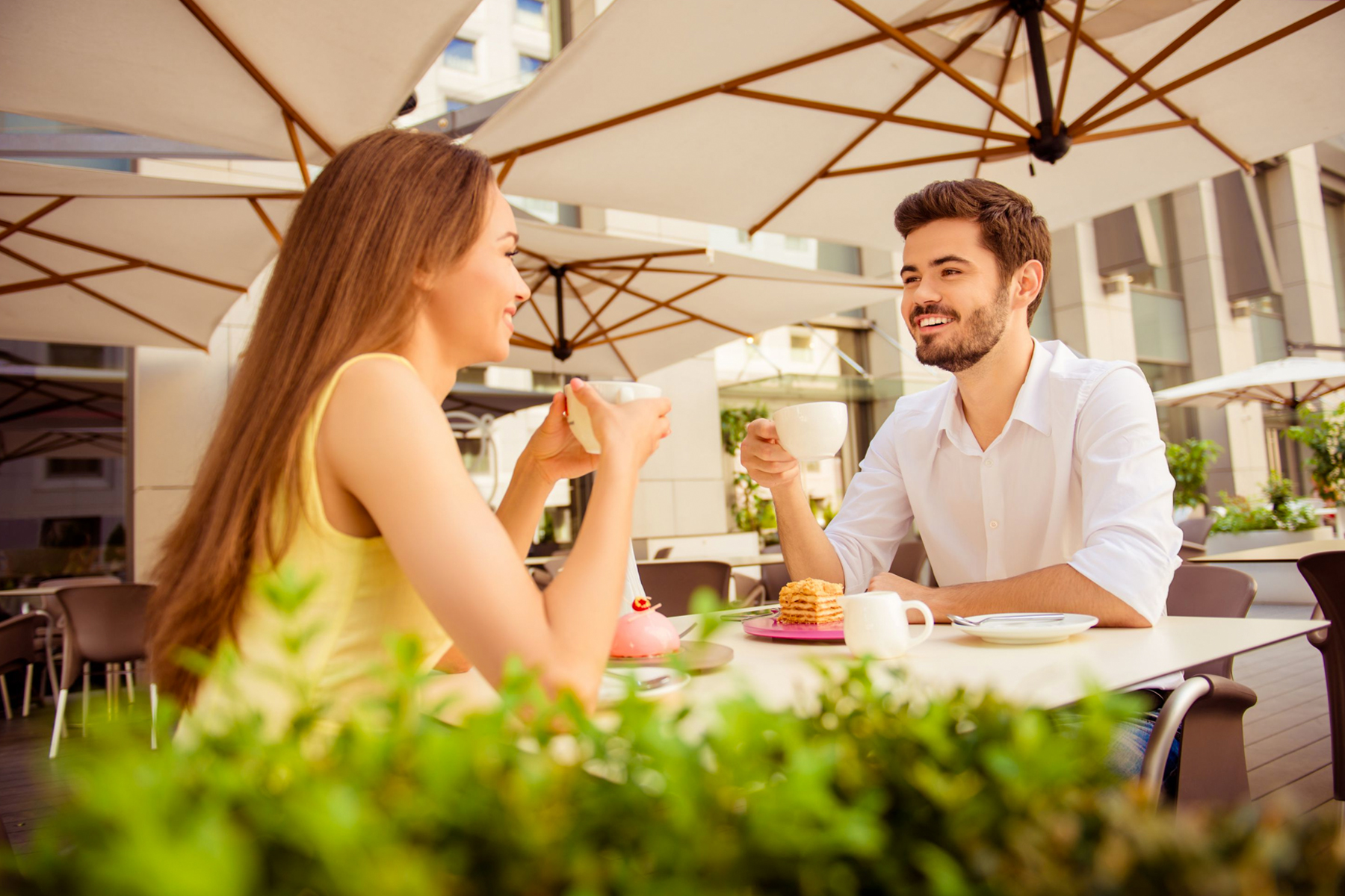 couple having a delicious lunch outdoors at a restaurant